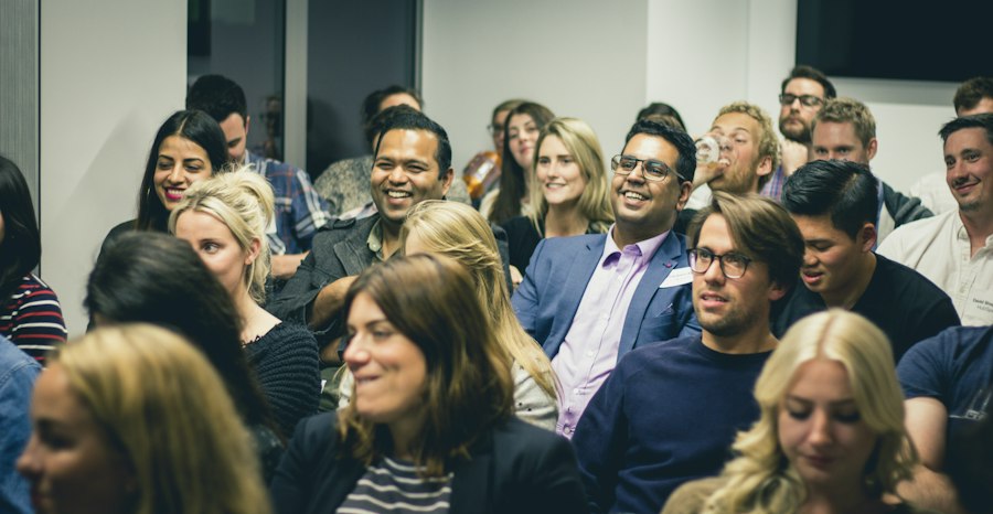 An audience of professionals listening at a seminar