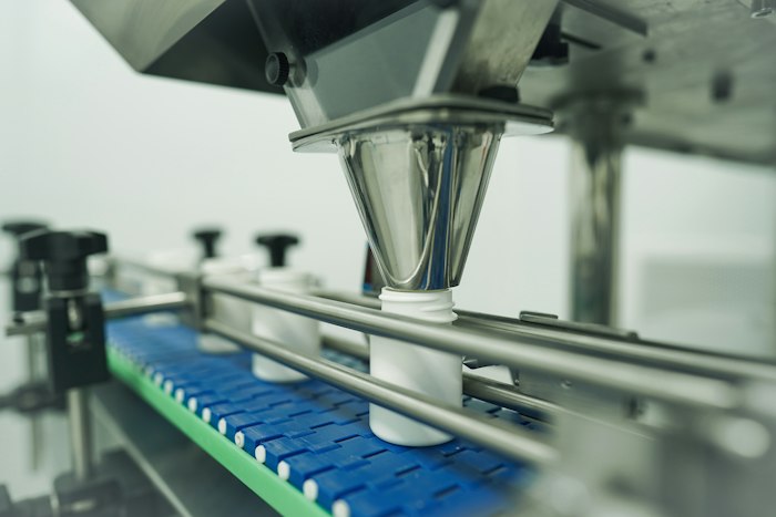 Bottles being filled on an automated pharmaceutical production line